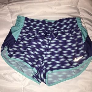 Teal and purple nike running shorts